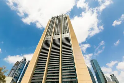 a tall building with a blue sky in the background at 1BR Burj Khalifa View Index Tower DIFC in Dubai