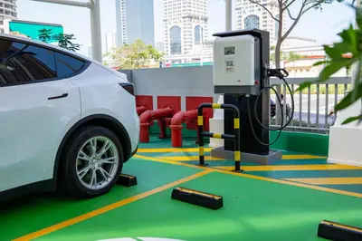 a white car is parked next to a gas pump at Citadines Metro Central Dubai in Dubai