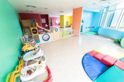 a childs room with a play area and a room with at Divine Burj & Opera Views - 2BDR - DOWNTOWN DUBAI in Dubai