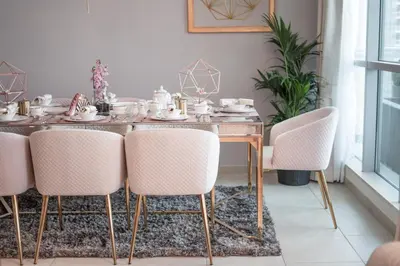 a dining room with a table and chairs at Elite Royal Apartment - Full Burj Khalifa & Fountain View - Crystal in Dubai