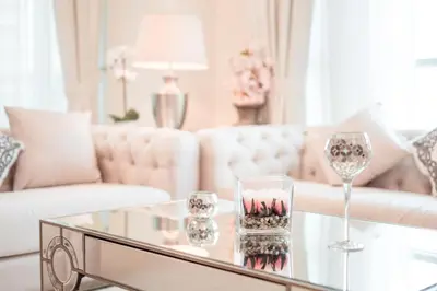 a living room with a white couch and a glass table at Elite Royal Apartment - Full Burj Khalifa & Fountain View - Crystal in Dubai