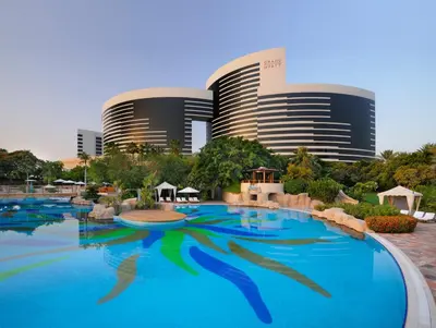a large swimming pool in front of a resort at Grand Hyatt Residence in Dubai