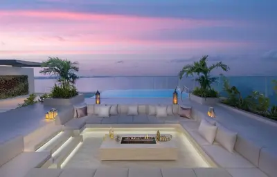 a living room with a couch and a table at Mandarin Oriental Jumeira, Dubai in Dubai