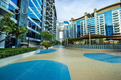 a courtyard in a city with tall buildings at Oceana Residences, Free beach & pool access in Dubai