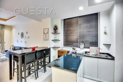 a kitchen with a black counter top and a sink at Oceana Residences, Free beach & pool access in Dubai