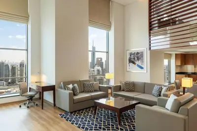 a living room with a couch and a table at Sheraton The Walk, Dubai in Dubai