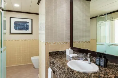 a bathroom with a sink and a toilet at Sheraton The Walk, Dubai in Dubai