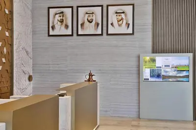 a room with three framed pictures on the wall at Courtyard by Marriott Dubai, Al Barsha in Dubai