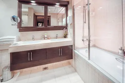 a bathroom with a tub and a sink and a shower at Elite Royal Apartment - Burj Residences T5 | VIP in Dubai