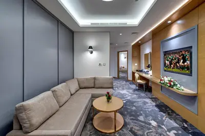 a living room with a couch and a table at The S Hotel Al Barsha in Dubai