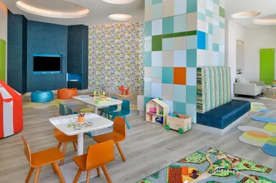 a childrens play room with a table and chairs at Address Dubai Mall in Dubai