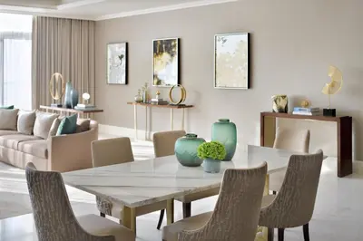 a dining room with a table and chairs at Address Dubai Mall in Dubai