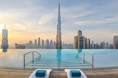 a infinity pool with a view of the dubai skyline at Address Sky View, Downtown Dubai in Dubai