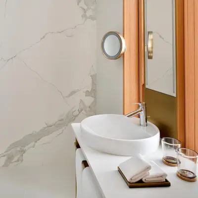 a bathroom with a white sink and a mirror at Vida Creek Harbour in Dubai