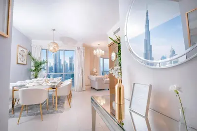 a dining room with a table and a mirror at Elite Royal Apartment | Burj Residences Tower 5 | Gold in Dubai