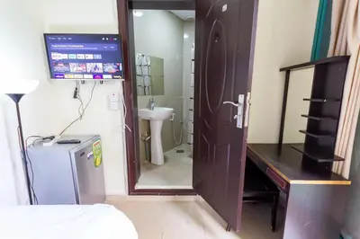 a room with a bathroom with a sink and a mirror at Budget Rooms With Private Bathroom for 'girls' only in Dubai, Marina in Dubai