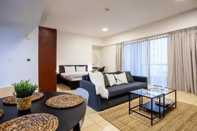 a living room with a couch and a table at Big Studio in Rimal at The Beach JBR in Dubai