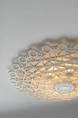a chandelier hanging from a ceiling at Hotel Indigo Dubai Downtown by IHG in Dubai