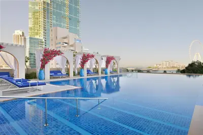 a swimming pool on the roof of a building at JA Ocean View Hotel, Jumeirah Beach Dubai in Dubai