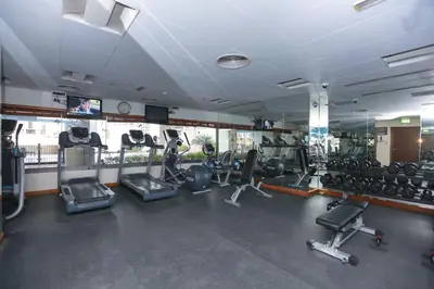 a gym with several treadmills and cardio machines at Prime Retreats - Downtown Dubai in Dubai