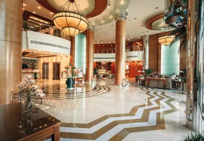 a lobby of a hotel with a large lobby at Roda Al Murooj Residences in Dubai