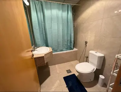 a bathroom with a toilet and a sink and a shower at comfortable Rooms For Girls in Marina Dubai, the best offer in Dubai