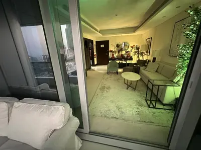a living room with a couch and a table at Downtown Al Bahar Apartments in Dubai