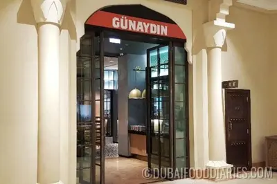 a lobby with a revolving door in a building at Downtown Al Bahar Apartments in Dubai