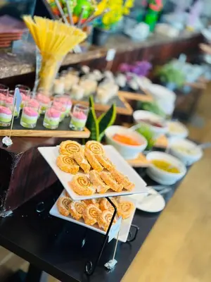 a buffet of food with pretzels and other foods at JOIN INN HOTEL Jebel Ali, Dubai - Formerly easyHotel Jebel Ali in Dubai