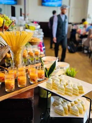 a buffet line with food and drinks and snacks at JOIN INN HOTEL Jebel Ali, Dubai - Formerly easyHotel Jebel Ali in Dubai