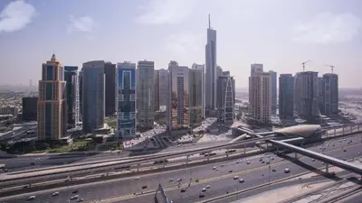 a city with a highway and many tall buildings at Deluxe Studio for Rent at Marina View Towers in Dubai