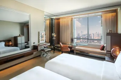 a bedroom with a bed and a view of the city at Paramount Hotel Dubai in Dubai