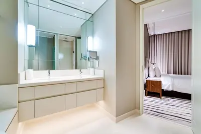 a bathroom with a sink and a mirror at Vida Downtown Residences in Dubai