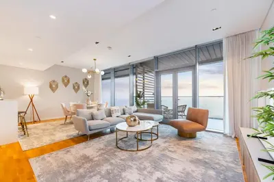 a living room with a couch and a table at FAM Living Bluewaters - Island Living - Ain Dubai & Sea View in Dubai