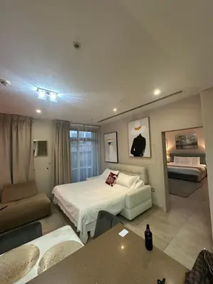 a hotel room with a bed and a couch at Magic waves holiday in Dubai