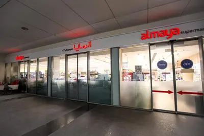 a store front with glass doors in a building at Prime Retreats- Downtown Dubai in Dubai