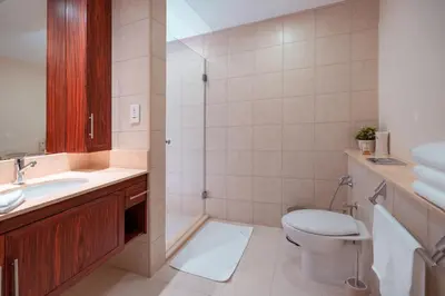 a bathroom with a toilet and a sink at Elite Royal Apartment - Full Burj Khalifa & Fountain View - 2 bedrooms and 1 open bedroom without partition in Dubai