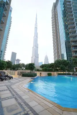 a swimming pool in the middle of a city with buildings at Elite Royal Apartment - Full Burj Khalifa & Fountain View - 2 bedrooms and 1 open bedroom without partition in Dubai