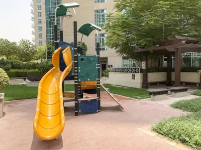 a playground with a slide in a park at Elite Royal Apartment - Full Burj Khalifa & Fountain View - Deluxe in Dubai
