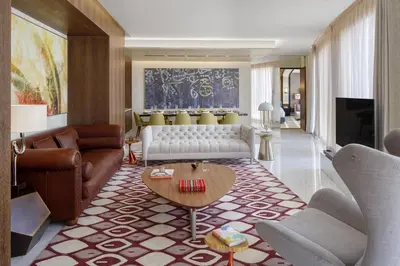 a living room with a couch and a table at Andaz Dubai The Palm, By Hyatt in Dubai