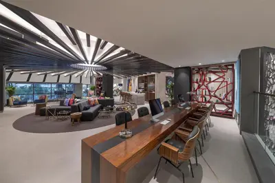 an office with a long desk and chairs at Andaz Dubai The Palm, By Hyatt in Dubai