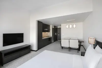 a living room with a television and a table at Hyatt Place Dubai Jumeirah Residences in Dubai