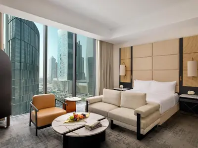 a hotel room with a bed and a large window at Anantara Downtown Dubai in Dubai
