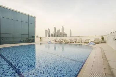 a swimming pool on the roof of a building at GuestReady - Modern Studio | Stunning Marina Views in Dubai