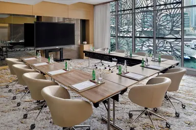 a conference room with a long table and chairs at Crowne Plaza Dubai Marina by IHG in Dubai