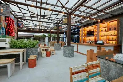 a restaurant with a bar and tables and benches at Citymax Hotel Business Bay in Dubai
