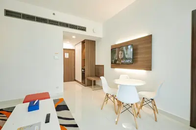 a dining room with a table and white chairs at Citymax Hotel Business Bay in Dubai