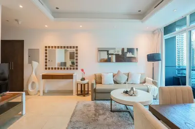 a living room with a couch and a table at HiGuests - Spacious 1BR in Dubai Marina With Amazing Views in Dubai
