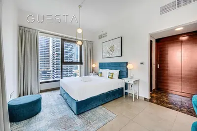 a hotel room with a bed and a window at Sparkle Tower, Dubai Marina in Dubai