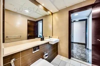 a bathroom with a sink and a mirror at Sparkle Tower, Dubai Marina in Dubai